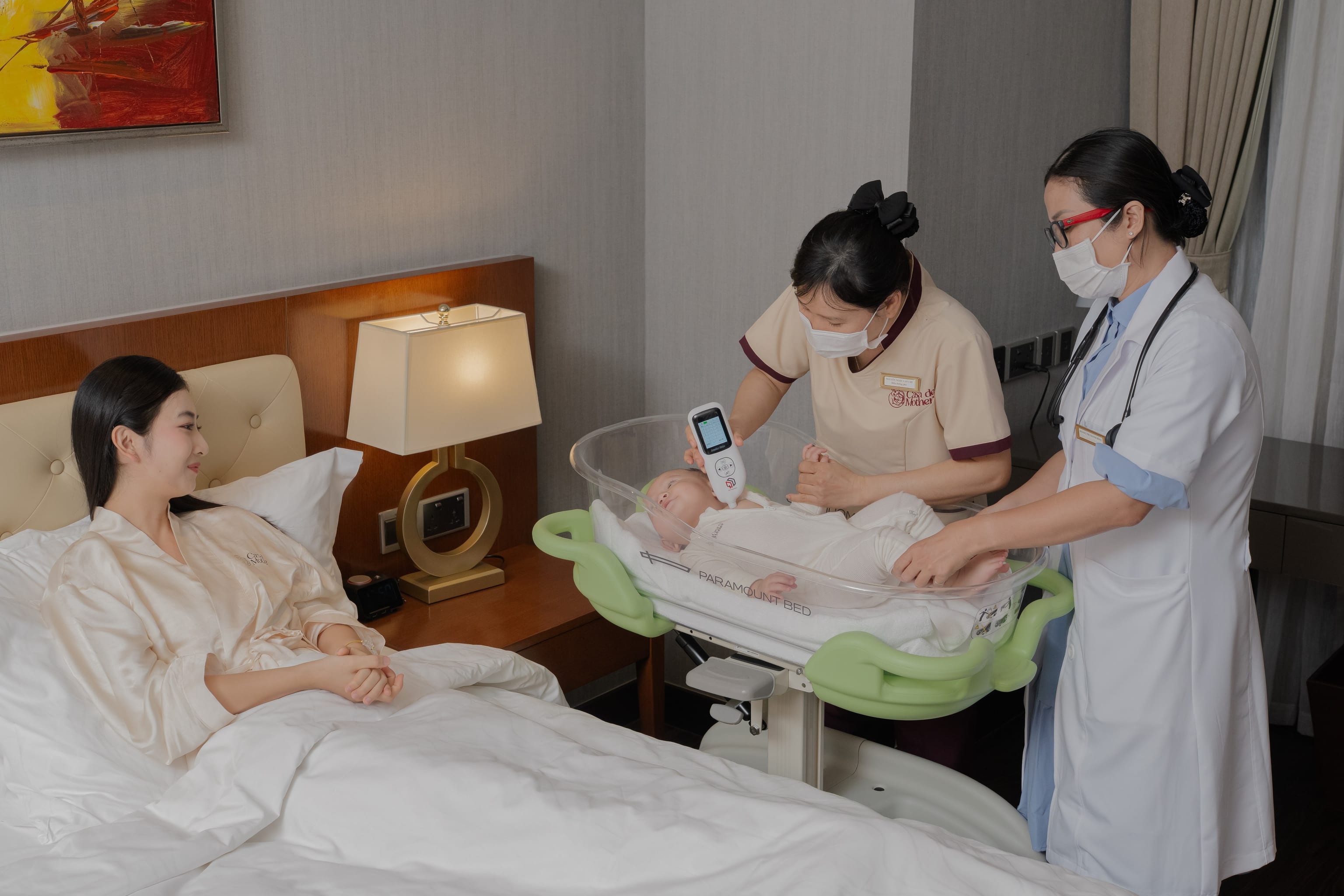 Nurse measuring a newborn's jaundice with a handheld meter